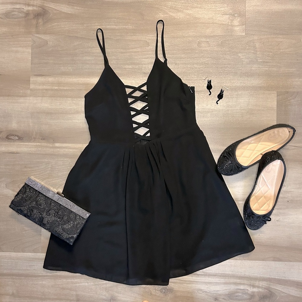 Millau Black Dress with criss cross straps in front and back.